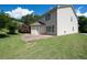 Spacious backyard featuring a well-manicured lawn and a brick patio, perfect for outdoor entertainment at 45 Waterloo Ct, Hiram, GA 30141
