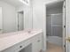 Bright bathroom with a large mirror, vanity with sink, and tiled shower at 45 Waterloo Ct, Hiram, GA 30141