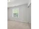Comfortable bedroom featuring neutral walls and carpet, ample light, and a closet with sliding doors at 45 Waterloo Ct, Hiram, GA 30141
