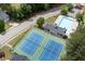 Aerial view showing community amenities including a tennis court, pool and playground at 45 Waterloo Ct, Hiram, GA 30141