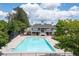 A large community pool with a recreation center featuring a playground and tennis court nearby at 45 Waterloo Ct, Hiram, GA 30141