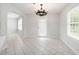 Bright dining area featuring tile floors and an elegant chandelier at 45 Waterloo Ct, Hiram, GA 30141