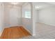 Bright entryway with hardwood floors, a white front door, and an open view into adjacent living spaces at 45 Waterloo Ct, Hiram, GA 30141