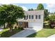 Charming two-story home with a well-maintained lawn, a two-car garage, and classic shutters at 45 Waterloo Ct, Hiram, GA 30141