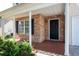 Inviting front porch with stone accents, tiled flooring, and elegant white columns at 45 Waterloo Ct, Hiram, GA 30141