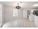 Bright eat-in kitchen with white cabinets, tile floor and stainless steel appliances at 45 Waterloo Ct, Hiram, GA 30141