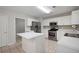 Eat-in kitchen features white cabinets, an island, and stainless steel appliances at 45 Waterloo Ct, Hiram, GA 30141