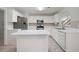 Eat-in kitchen with white cabinets and stainless steel appliances at 45 Waterloo Ct, Hiram, GA 30141