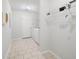 Bright laundry room boasts tile floor, utility sink, and washer and dryer at 45 Waterloo Ct, Hiram, GA 30141
