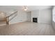 Open-concept living room with fireplace and tiled floor at 45 Waterloo Ct, Hiram, GA 30141