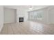 Bright living room features a fireplace, ceiling fan, and large window at 45 Waterloo Ct, Hiram, GA 30141