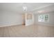 Neutral-toned living room with tile flooring, chandelier, and doorway into entry area at 45 Waterloo Ct, Hiram, GA 30141
