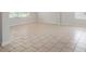 Open living room featuring large neutral tile flooring and bright natural lighting at 45 Waterloo Ct, Hiram, GA 30141
