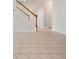 Tile flooring leading to wooden staircase with white risers at 45 Waterloo Ct, Hiram, GA 30141