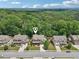 Aerial view of the homes in the neighborhood, showcasing well-kept lawns and tree coverage at 1136 Garner Creek At Parkview Sw Dr, Lilburn, GA 30047