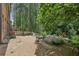 Backyard featuring a koi pond and lush greenery, creating a serene outdoor oasis at 1136 Garner Creek At Parkview Sw Dr, Lilburn, GA 30047