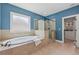 Bright bathroom features a soaking tub and glass enclosed shower next to a storage area at 1136 Garner Creek At Parkview Sw Dr, Lilburn, GA 30047