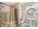 Accessible bathroom with accessible shower, sink, and fixtures at 1136 Garner Creek At Parkview Sw Dr, Lilburn, GA 30047