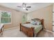 Comfortable bedroom with a ceiling fan and natural light from two large windows at 1136 Garner Creek At Parkview Sw Dr, Lilburn, GA 30047