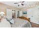 Comfortable bedroom with a dresser, queen bed, and wood floors at 1136 Garner Creek At Parkview Sw Dr, Lilburn, GA 30047