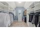 Large walk-in closet with custom shelving and storage solutions provides ample space for organization at 1136 Garner Creek At Parkview Sw Dr, Lilburn, GA 30047