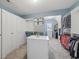 Spacious walk-in closet features built-in shelving, cabinets, and a center island for storage at 1136 Garner Creek At Parkview Sw Dr, Lilburn, GA 30047