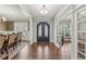 Elegant foyer showcasing hardwood floors, double doors, and dining room view at 1136 Garner Creek At Parkview Sw Dr, Lilburn, GA 30047
