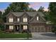Elegant two-story brick home with a covered porch and well-manicured lawn at 1136 Garner Creek At Parkview Sw Dr, Lilburn, GA 30047