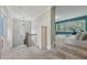Upstairs hallway leads to a seating area with bright windows and a stationary bike at 1136 Garner Creek At Parkview Sw Dr, Lilburn, GA 30047