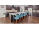 Spacious kitchen with a large island, stainless steel appliances, and dark wood cabinets at 1136 Garner Creek At Parkview Sw Dr, Lilburn, GA 30047