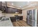 Modern terrace level kitchen boasts stainless steel appliances and granite countertops at 1136 Garner Creek At Parkview Sw Dr, Lilburn, GA 30047