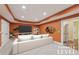 Stylish terrace level living room with recessed lighting, neutral colors, and ample space at 1136 Garner Creek At Parkview Sw Dr, Lilburn, GA 30047