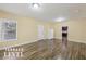 Terrace level room features hardwood floors, windows, refrigerator and backyard access at 1136 Garner Creek At Parkview Sw Dr, Lilburn, GA 30047