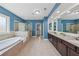 Luxurious main bathroom with soaking tub, walk-in shower, and double vanity at 1136 Garner Creek At Parkview Sw Dr, Lilburn, GA 30047