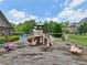 Community playground with play structure and bug-themed spring riders next to the pool at 1136 Garner Creek At Parkview Sw Dr, Lilburn, GA 30047