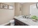 Well-lit powder room featuring a granite countertop and a decorative mirror at 1136 Garner Creek At Parkview Sw Dr, Lilburn, GA 30047