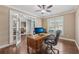 Bright office space with hardwood floors, French doors, and a large window providing ample natural light at 1136 Garner Creek Sw Dr, Lilburn, GA 30047