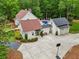 Expansive property featuring a beautiful two-story home, in-ground pool, two-car garage, and a large driveway at 400 N Peachtree Pkwy, Peachtree City, GA 30269