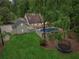 Aerial view of a home with a large yard, fenced pool area, and a trampoline surrounded by lush greenery at 400 N Peachtree Pkwy, Peachtree City, GA 30269