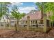 Beautiful backyard with a fenced pool area and lush greenery, offering privacy and charm at 400 N Peachtree Pkwy, Peachtree City, GA 30269