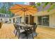 Outdoor dining area on wooden deck, perfect for backyard gatherings at 400 N Peachtree Pkwy, Peachtree City, GA 30269