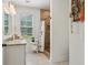 Bathroom features granite counter tops, wood-look shower and floral shower curtain at 400 N Peachtree Pkwy, Peachtree City, GA 30269