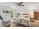Cozy bedroom featuring a ceiling fan, natural light, and decorative accents at 400 N Peachtree Pkwy, Peachtree City, GA 30269