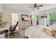 Bright bedroom with desk, and ample storage, offering a comfortable living space at 400 N Peachtree Pkwy, Peachtree City, GA 30269