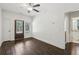 Bonus room features a ceiling fan, hardwood floors, an outdoor access door, and an entrance to another room at 400 N Peachtree Pkwy, Peachtree City, GA 30269