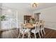 Bright dining room featuring a dining table set for six and decorative wall trim at 400 N Peachtree Pkwy, Peachtree City, GA 30269