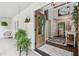 Inviting foyer with an open doorway, wood floors, and elegant decor, creating a warm and welcoming entrance at 400 N Peachtree Pkwy, Peachtree City, GA 30269