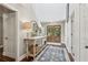 Warm and welcoming foyer with double doors, a neutral rug and an inviting ambiance at 400 N Peachtree Pkwy, Peachtree City, GA 30269