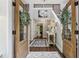 Warm and inviting front foyer featuring neutral decor, beautiful tile, and a view of the staircase at 400 N Peachtree Pkwy, Peachtree City, GA 30269
