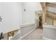 Upstairs hallway with fresh paint, carpet and doors leading to various rooms at 400 N Peachtree Pkwy, Peachtree City, GA 30269